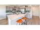 Modern kitchen featuring a large center island, stainless steel appliances, and sleek cabinetry at 7441 Bosco Brook # 104, North Las Vegas, NV 89084