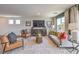Comfortable and stylish living room with neutral tones, plush seating, and ample natural light at 7441 Bosco Brook # 104, North Las Vegas, NV 89084
