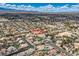 Expansive aerial view showcases home in desert community, highlighting the property's setting and neighborhood layout at 7521 Prancing Pony Ct, Las Vegas, NV 89131