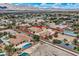 Stunning aerial perspective of the home, highlighted by a detached garage, pool, and a recreational area at 7521 Prancing Pony Ct, Las Vegas, NV 89131