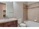 Full bathroom featuring a tiled shower-tub combo and a vanity with ample storage space at 7521 Prancing Pony Ct, Las Vegas, NV 89131