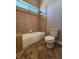 Cozy bathroom with a tiled shower-tub combo and a standard toilet, creating a functional space at 7521 Prancing Pony Ct, Las Vegas, NV 89131