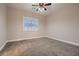 Cozy bedroom with carpeted flooring and a window, offering a comfortable and relaxing atmosphere at 7521 Prancing Pony Ct, Las Vegas, NV 89131