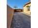 Long driveway leading to a gated entrance showcasing a detailed horse design at 7521 Prancing Pony Ct, Las Vegas, NV 89131