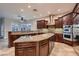 Spacious kitchen boasting granite countertops, stainless steel appliances, and a kitchen island at 7521 Prancing Pony Ct, Las Vegas, NV 89131