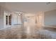 Bright living room with tile floors, recessed lighting and glass french doors to other rooms at 7521 Prancing Pony Ct, Las Vegas, NV 89131