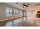 Spacious living room with tile floors and custom shutters at 7521 Prancing Pony Ct, Las Vegas, NV 89131