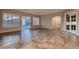 Bright living room featuring tile floors, recessed lighting and glass french doors at 7521 Prancing Pony Ct, Las Vegas, NV 89131
