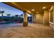 Covered patio featuring stamped concrete, columns, and a view of the beautiful pool at 7521 Prancing Pony Ct, Las Vegas, NV 89131
