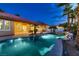 Luxurious pool featuring a waterfall, lush landscaping, and ample space for outdoor living at 7521 Prancing Pony Ct, Las Vegas, NV 89131