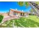 Charming home featuring a spacious backyard with a covered patio, perfect for outdoor entertaining and relaxation at 7533 Grenfell Dr, Las Vegas, NV 89129