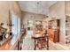 Elegant dining room featuring vaulted ceilings, wooden furniture, and natural light creating a sophisticated atmosphere at 7533 Grenfell Dr, Las Vegas, NV 89129
