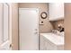Functional laundry room with a washer, dryer, and storage cabinets at 7533 Grenfell Dr, Las Vegas, NV 89129