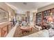 Spacious living room with stylish decor, built-in bookcase, plush seating, and abundant natural light at 7533 Grenfell Dr, Las Vegas, NV 89129