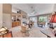 Open-concept living room with a fireplace, recessed lighting, and sliding glass doors to the patio at 7533 Grenfell Dr, Las Vegas, NV 89129