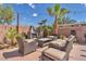 Relaxing outdoor seating area with comfortable chairs, a table, and a barbecue grill, great for entertaining at 7860 Villa Del Fuego, Las Vegas, NV 89131