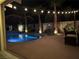 Beautiful backyard pool with water feature and mature palms, perfect for relaxing in a private oasis at 7860 Villa Del Fuego, Las Vegas, NV 89131