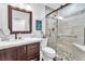 Modern bathroom featuring a glass shower with a pebble floor and upgraded tile at 7860 Villa Del Fuego, Las Vegas, NV 89131