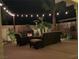 Inviting outdoor patio with a cozy fireplace and comfortable seating area for relaxation and entertaining at 7860 Villa Del Fuego, Las Vegas, NV 89131