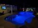 Stunning backyard pool illuminated at night, creating a serene and inviting atmosphere for relaxation and enjoyment at 7860 Villa Del Fuego, Las Vegas, NV 89131