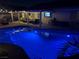 Backyard swimming pool with LED lighting and covered patio, great for outdoor entertaining at 7860 Villa Del Fuego, Las Vegas, NV 89131