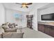 Relaxing room with comfortable seating, bookshelves, and a built-in beverage bar at 7860 Villa Del Fuego, Las Vegas, NV 89131