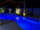 Gorgeous backyard with a sparkling swimming pool and elegant water feature, ideal for outdoor entertaining at 7860 Villa Del Fuego, Las Vegas, NV 89131