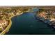 Stunning aerial view of lakeside homes with lush landscaping, boat docks, and a tranquil atmosphere at 7968 Marbella Cir, Las Vegas, NV 89128