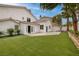 Spacious backyard with lush artificial turf and a concrete patio, great for entertaining at 7968 Marbella Cir, Las Vegas, NV 89128