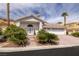 Charming single-story home with a three-car garage, tile roof, and drought-tolerant landscaping at 7968 Marbella Cir, Las Vegas, NV 89128