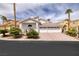 Stunning single-story home featuring a three-car garage, tile roof and desert landscaping at 7968 Marbella Cir, Las Vegas, NV 89128
