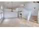 Bright living room featuring a chandelier, wet bar, and staircase to the second level at 7968 Marbella Cir, Las Vegas, NV 89128