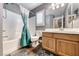 Well-lit bathroom features a bathtub, shower, vanity with storage, and a modern design at 8348 Mountain Destiny Ave, Las Vegas, NV 89131