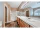 Spacious bathroom featuring double sinks, tile floors, and a separate shower, combining style and functionality at 8348 Mountain Destiny Ave, Las Vegas, NV 89131
