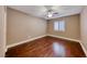 Tranquil bedroom featuring wood floors, neutral walls, and a bright window, perfect for relaxation at 8348 Mountain Destiny Ave, Las Vegas, NV 89131