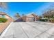 Long driveway leading to a well-kept home with drought resistant landscaping on a sunny day at 8348 Mountain Destiny Ave, Las Vegas, NV 89131