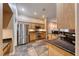 Spacious kitchen boasts stainless steel appliances and stone tile flooring at 8348 Mountain Destiny Ave, Las Vegas, NV 89131