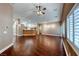 Open-concept living room with hardwood floors and plantation shutters at 8348 Mountain Destiny Ave, Las Vegas, NV 89131