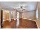 The main bedroom has hard wood floors, a ceiling fan, and en suite bathroom at 8348 Mountain Destiny Ave, Las Vegas, NV 89131