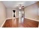 The main bedroom has wood floors, a ceiling fan, and three entryways at 8348 Mountain Destiny Ave, Las Vegas, NV 89131