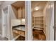 This pantry features ample shelving space and a built in desk area for your organizing needs at 8348 Mountain Destiny Ave, Las Vegas, NV 89131