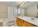 Inviting bathroom featuring a double vanity, bathtub, and tile floor at 8407 Kettledrum St, Las Vegas, NV 89139