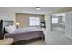 Comfortable bedroom with soft carpet, neutral walls, and a second-floor view at 8407 Kettledrum St, Las Vegas, NV 89139