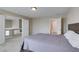 Comfortable bedroom featuring neutral walls, carpet, and a bathroom entrance off the bedroom at 8407 Kettledrum St, Las Vegas, NV 89139