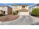 Inviting two-story home featuring a two-car garage and low maintenance front yard at 8407 Kettledrum St, Las Vegas, NV 89139