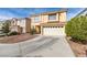 Inviting two-story home featuring a two-car garage and low maintenance front yard at 8407 Kettledrum St, Las Vegas, NV 89139