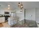Bright kitchen with white cabinets, granite countertops, stainless steel appliances, and a breakfast bar at 8407 Kettledrum St, Las Vegas, NV 89139