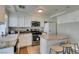 Functional kitchen featuring white cabinets, stainless steel appliances, and a breakfast bar at 8407 Kettledrum St, Las Vegas, NV 89139