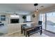 Dining area with a view into the living room, and a sliding door to the backyard and pool at 8407 Kettledrum St, Las Vegas, NV 89139