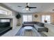 Bright living room features plush grey sectional sofa and views into the kitchen at 8407 Kettledrum St, Las Vegas, NV 89139